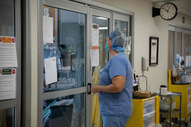 A healthcare professional prepares to enter a Covid-19 patient's room Picture: Megan Jelinger / AFP via Getty Images