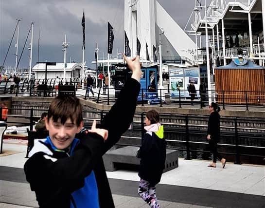Joseph Tillotson in front of the Spinnaker Tower which he plans to abseil in aid of Simon Says, a charity which helped him through the loss of his grandad.