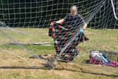 Scared fox gets trapped in goal netting...watch how he gets rescued