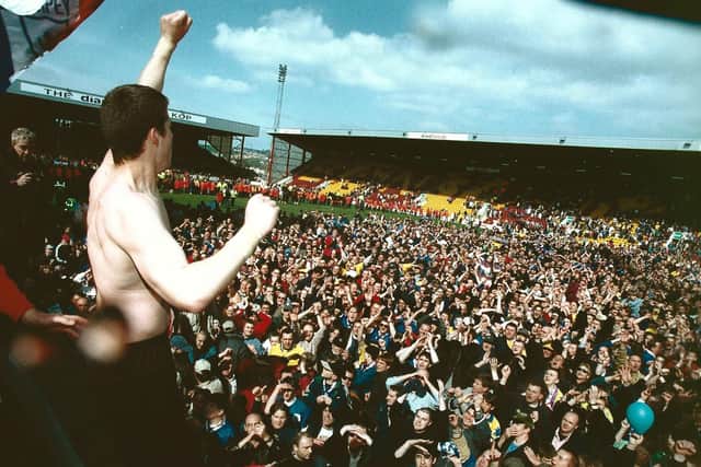 Aaron Flahavan celebrates with the Pompey fans at Valley Parade after a 3-1 win over Bradford preserves their Division One status in May 1998