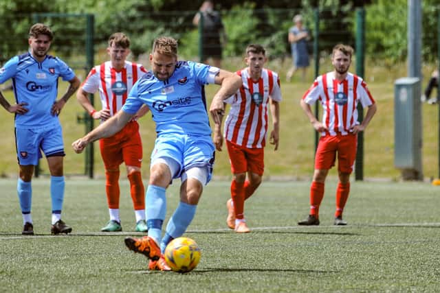 Brett Pitman converts a penalty on his Portchester debut in a friendly with Lymington Town. Picture by Daniel Haswell