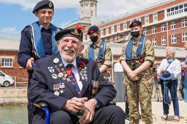 D-Day veteran Joe Cattini (98) escorted by Portsmouth Sea Cadet Hayden Temperton (13). Picture: Mike Cooter (250621)