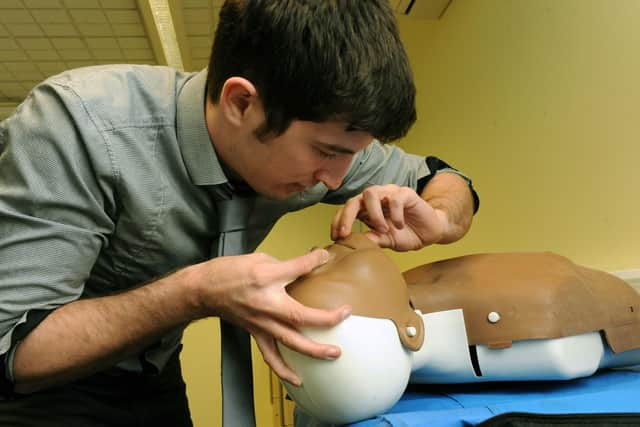 Defence correspondent Tom Cotterill shows how to open an airway of someone who isn't breathing during a training event in Littlehampton