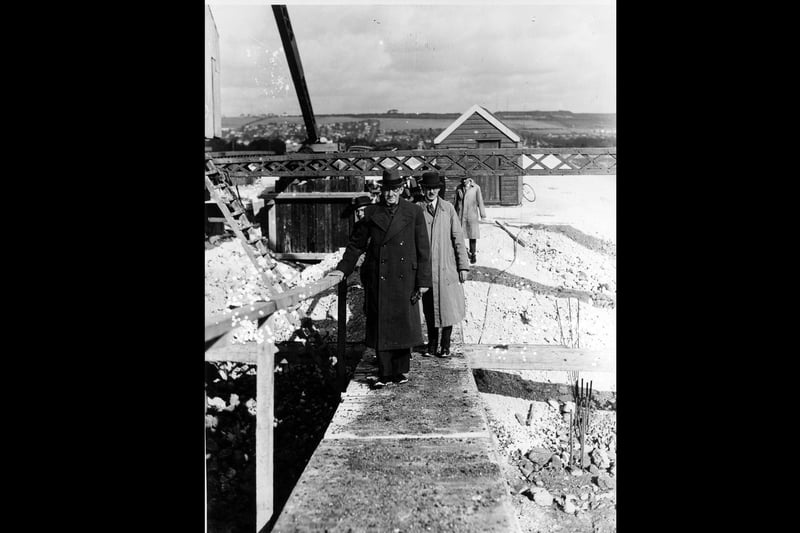 Businessmen walking across the construction site on Eastern Road in 1938. The News PP5297