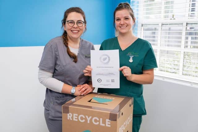 Vet Ella Townsend (left) and veterinary nurse Abi Hayes with St Peter's Vets iiE certificate