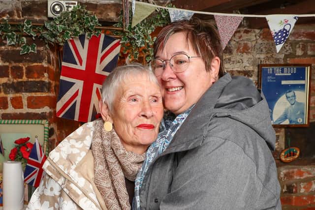 Fiona Brown and her mother Violet Graham pictured in the 19 FourTeas Tea Rooms in Havant after lockdown restrictions were relaxed allowing inside dining and hugs. Picture: Stuart Martin (220421-7042)