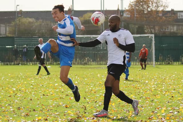 Action from the PDFA Trophy tie between AC Copnor (blue/white) and Lakeside. Picture by Kevin Shipp.