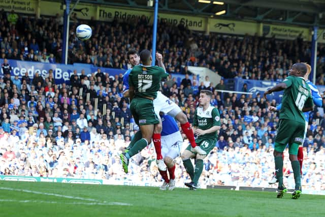 Danny Hollands heads home to register his Pompey hat-trick in a 3-3 draw with Plymouth in May 2014. Picture: Joe Pepler