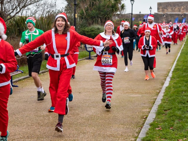 Runners undeterred by the weather start the Santa Fun Run at Southsea Castle