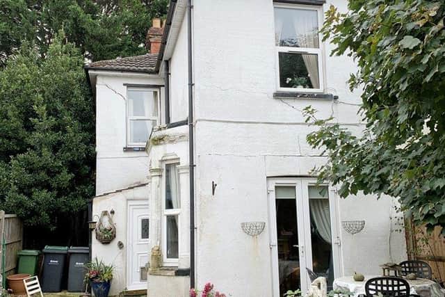 Guided freehold at £150,000-plus is a three-bedroom house at 21 London Road, Cowplain, Waterlooville.