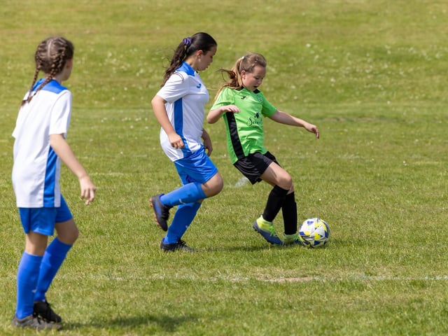Bedhampton Eagles U11s (green kit) up against Downgrange Wildcats (white kit) in the Clanfield youth football tournament at Horndean Technology College. Picture: Mike Cooter