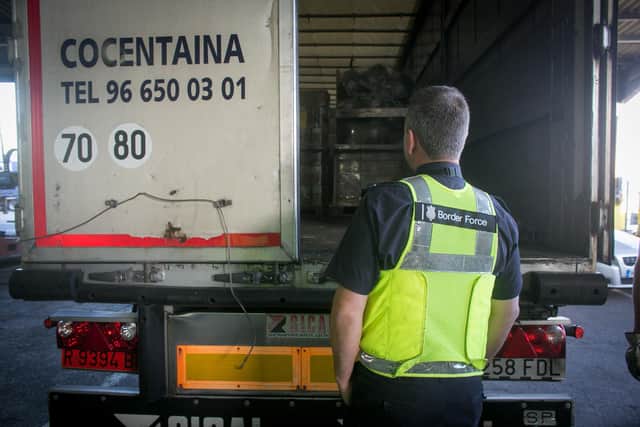 Border Force staff check inside the back of a lorry as it arrives at the UK border after leaving a cross-channel ferry in Portsmouth,  (Photo by Matt Cardy/Getty Images)