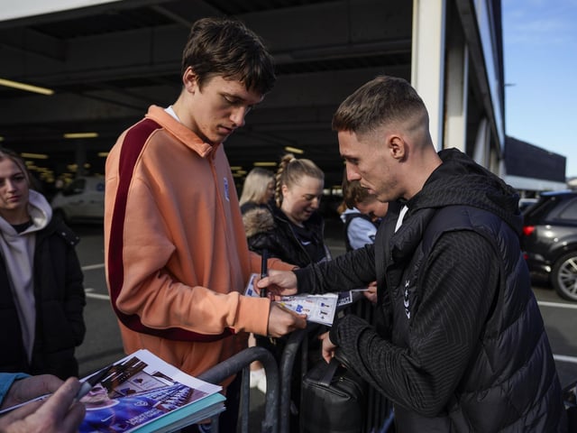 Gavin Whyte signs autographs before making his way into the ground