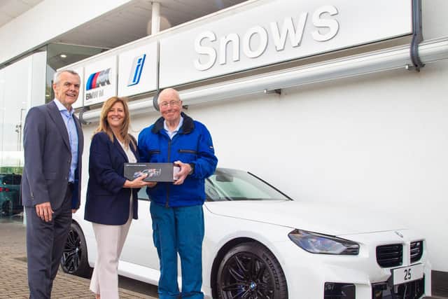George Kill is thanked for his loyalty to Snows and BMW by Stephen Snow, Chairman and CEO of Snows Motor Group, and Diana Mackinnon, Head Of Business for Snows BMW and MINI.