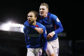 Marcus Harness celebrates with Ronan Curtis as Pompey registered a ninth consecutive Fratton Park triumph on Tuesday night. Picture: Joe Pepler