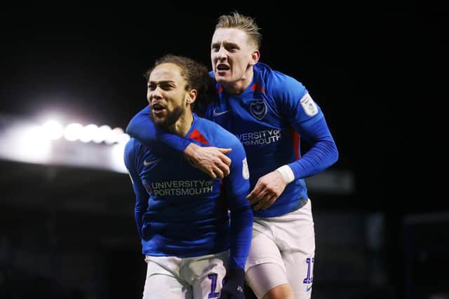 Marcus Harness celebrates with Ronan Curtis as Pompey registered a ninth consecutive Fratton Park triumph on Tuesday night. Picture: Joe Pepler