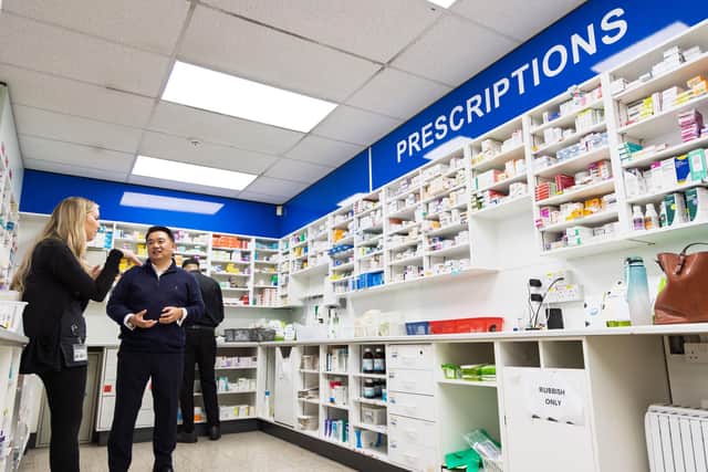 Alan Mak MP talks to manager Georgia Gates during his visit to Lalys Pharmacy on Hayling Island