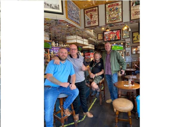 Punters at Duke of Devonshire on Albert Road, Southsea, celebrate pub keeping its licence