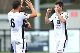 Charlie Sheringham, right, celebrates with Dartford skipper Tom Bonner at the final whistle of Sunday's play-off win at Slough. Photo by Warren Little/Getty Images.