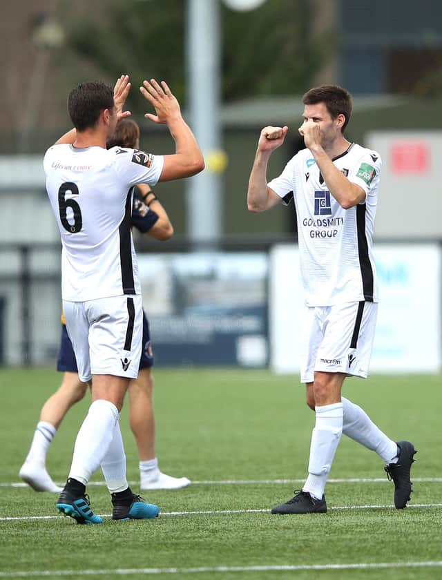 Charlie Sheringham, right, celebrates with Dartford skipper Tom Bonner at the final whistle of Sunday's play-off win at Slough. Photo by Warren Little/Getty Images.