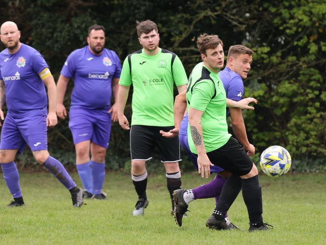 Action from the City of Portsmouth Sunday League Division Four match between AFC Bedhampton Village reserves (green and black kit) and Friends Fighting Cancer. Picture: Kevin Shipp