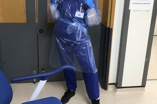 Student Amy Hughes, 20, getting ready for a volunteer shift during the Covid pandemic.