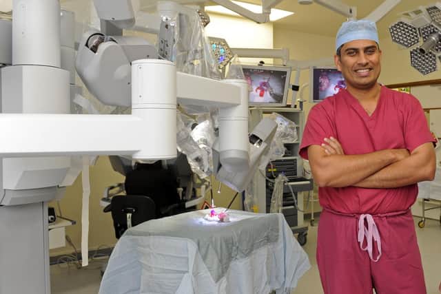 Surgeon Jim Khan pictured with the first Da Vinci robot at QA in 2013.
Pictures: Ian Hargreaves (132761-4c)