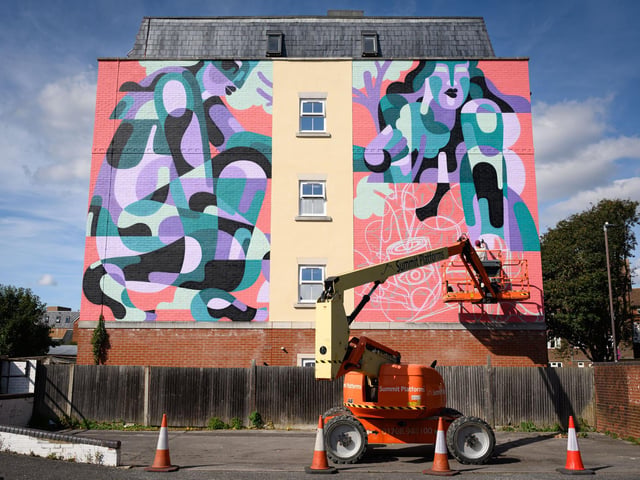 Pictured is: Reka One at work on his creation on the side of 23 St Pauls Road
Picture: Keith Woodland (140921-68)