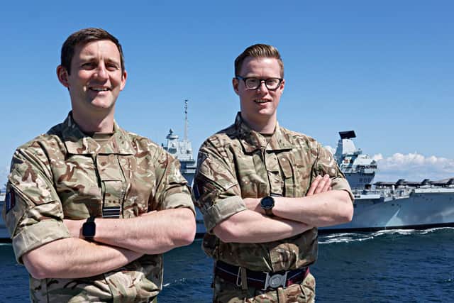 Flt Lts Chris Smith and Hayden Rose on HMS Prince of Wales with HMS Queen Elizabeth in background
