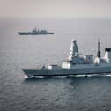 HMS Defender has returned home to Portsmouth, where she will be undergoing a major refit. Pictured is her monitoring Russian frigate Admiral Grigorovich. Picture: Royal Navy.