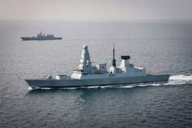 HMS Defender has returned home to Portsmouth, where she will be undergoing a major refit. Pictured is her monitoring Russian frigate Admiral Grigorovich. Picture: Royal Navy.