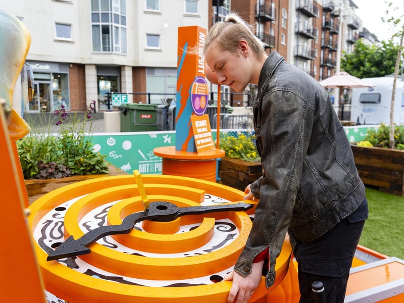 The new Art & Putt site has proved popular with Gunwharf Quays visitors - so much so that people have even enjoyied a game of mini golf in the rain. Picture: Matthew Clark