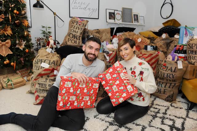 Sophie (28) and Dan Baker (30) from Waterlooville, started a group called PO Christmas present donation on Facebook in November, which has really taken off. Picture: Sarah Standing (101220-107)