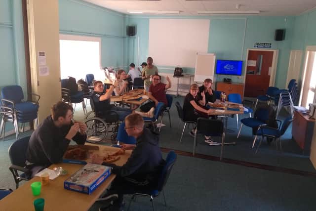 A group from Enable Ability are taking on a virtual Walk to Wembley to raise funds for the charity. Pictured: A previous group social and pizza