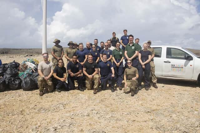 RFA Argus crew members pictured with volunteers from the island's turtle sanctuary.