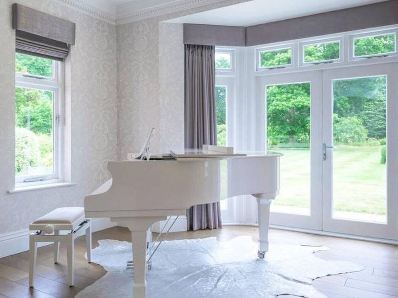 The listings says: "This magnificent country home offers extremely generous accommodation including seven bedrooms, four reception rooms, garaging for five cars, spectacular indoor pool complex and meticulously maintained gardens extending to about 5 acres."