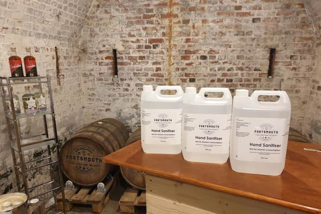 Vince Noyce and Giles Collighan, former Royal Navy officers, and Dich Oatley, a drinks industry professional, run the Portsmouth Distillery based at Fort Cumberland in Portsmouth. They have switched production to make hand sanitiser during the coronavirus crisis. Picture: Portsmouth Distillery