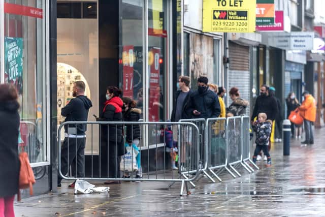 Shoppers standing outside Argos in Commercial Road, Portsmouth, just before the latest lockdown was announced in December. Photo: Andrew Hasson/Getty Images
