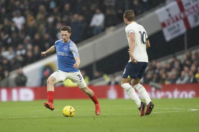 Denver Hume taking on Harry Kane.