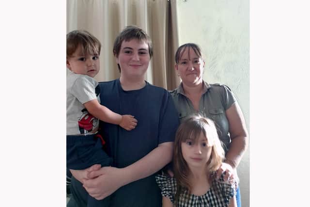 Elizabeth Wallace, 38, with children Rhys Padley, 15, Kira-Leigh Wallace, six, and Kai Wallace, two.