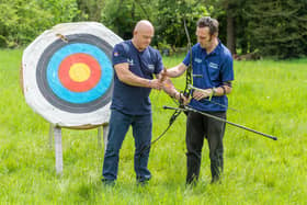 Gosport veteran Jay Saunders, pictured right, showing Help for Heroes patron and TV star Ross Kemp how to use a bow and arrow. IT comes as the pair are speaking out about the struggle veterans with PTSD face with the 'unfair' portrayal of troops with mental health conditions on TV and in films.