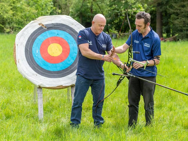 Gosport veteran Jay Saunders, pictured right, showing Help for Heroes patron and TV star Ross Kemp how to use a bow and arrow. IT comes as the pair are speaking out about the struggle veterans with PTSD face with the 'unfair' portrayal of troops with mental health conditions on TV and in films.