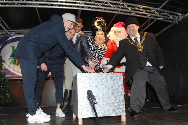 The Christmas lights switch-on in Commercial Road in Portsmouth in 2018.

Pictured is: (l-r) Portsmouth FC players Ronan Curtis and Craig MacGillivray, Jake Quickenden, Jack Edwards, Father Christmas and The Lord Mayor of Portsmouth Lee Mason.

Picture:Sarah Standing (180845-2001)