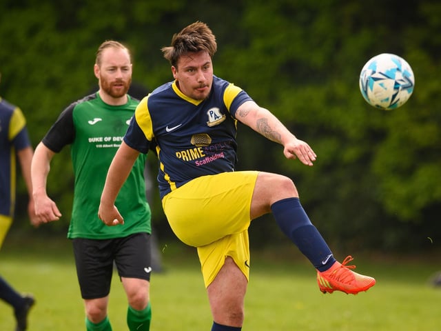 Action from Saturn Royale's 1-0 win over Pelham Arms (blue and yellow kit) in the second Adelaide Cup semi-final. Picture: Keith Woodland (300421-329)