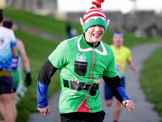 A number of runners took to the picturesque coastal route to take on the Portsmouth Coastal Waterside Marathon, Festive Half Marathon, as well as the Southsea 5k and 10k Turkey Trot. Picture: Chris  Moorhouse (221224-68)