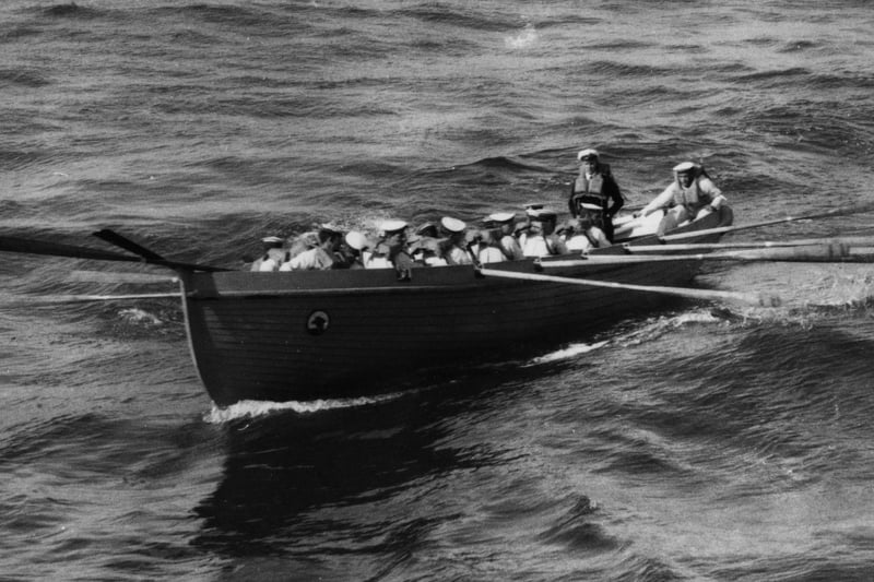 1923:  Some of the crew from HMS Hood rowing to land in the Canary Isles.  (Photo by Topical Press Agency/Getty Images)