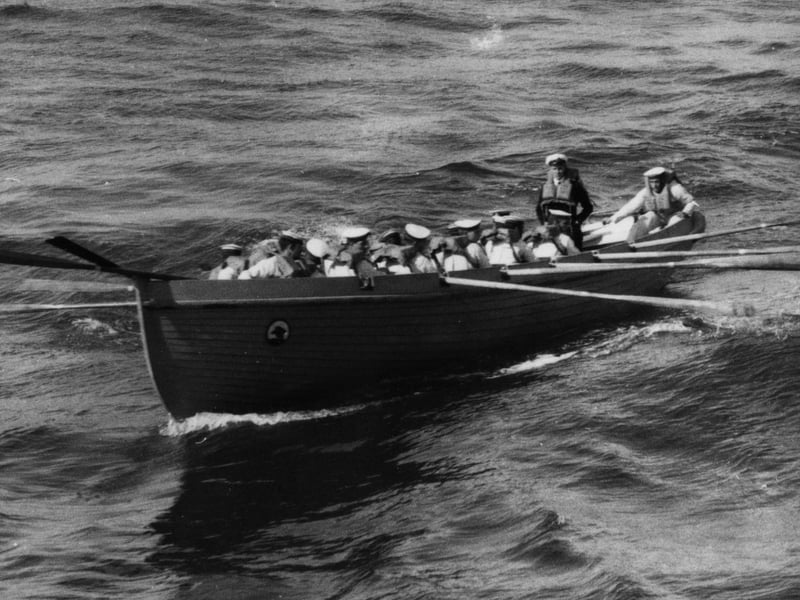 1923:  Some of the crew from HMS Hood rowing to land in the Canary Isles.  (Photo by Topical Press Agency/Getty Images)