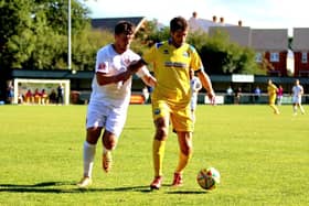 Gosport midfielder Danny Hollands, right, was sent off for two bookings at Hendon. Picture by Tom Phillips