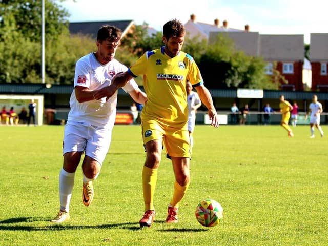 Gosport midfielder Danny Hollands, right, was sent off for two bookings at Hendon. Picture by Tom Phillips