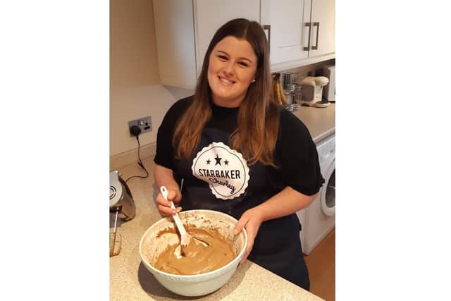 Charley Belcher, 21 from Waterlooville, baked hundreds of cakes to raise money for Alzheimer's Society. Pictured: Charley with one of her many cake mixes